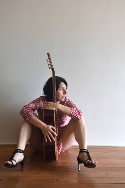 istock Woman with guitar 957750368