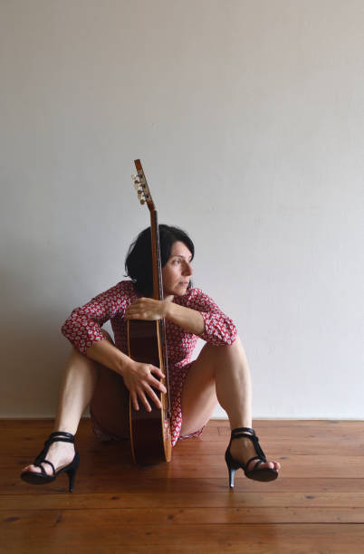 istock Woman with guitar 957750386