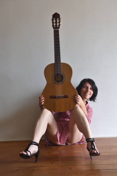 woman with guitar - full hair imagens e fotografias de stock