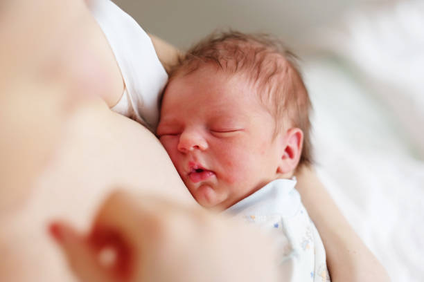 istock One day old newborn baby with mother 957751312