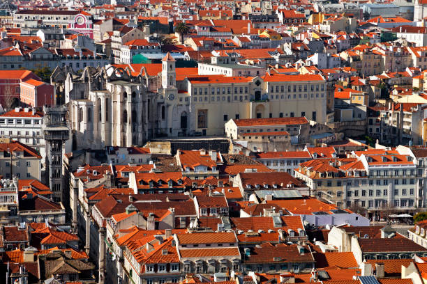 istock Carmo Convent ruins, Santa Justa lift or Elevator and orange rooftops 957754512