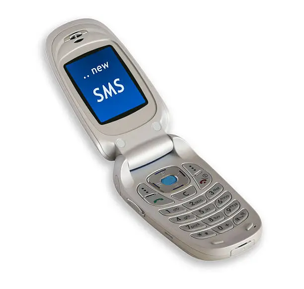 open clamshell cellphone with new SMS on white background with shade