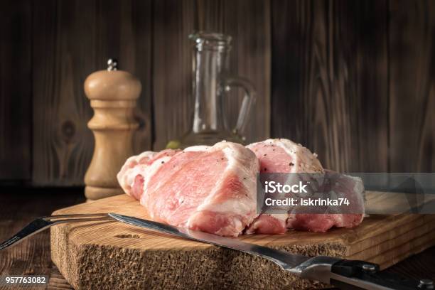 Slice Steaks Raw Pork Chop Marinated Meat Roll With Coarse Sea Salt Pepper And Olive Oil Stock Photo - Download Image Now
