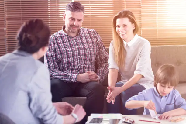 Photo of Family talking with son's teacher