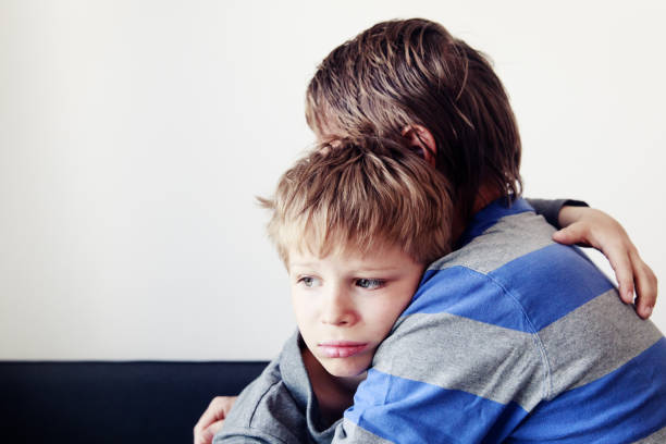 istock Father comforting sad child, parenting, sorrow 957763726