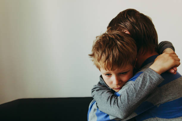 istock Father comforting sad child, parenting, sorrow 957763768