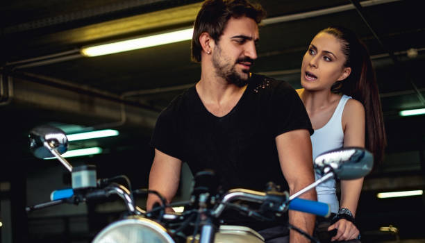 istock Angry girlfriend yelling at her biker boyfriend 957765594