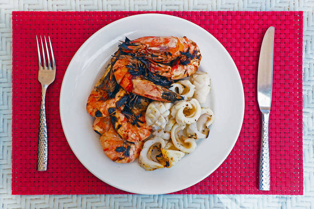 enjoy eating fresh grilled prawn and squid at luxury restaurant