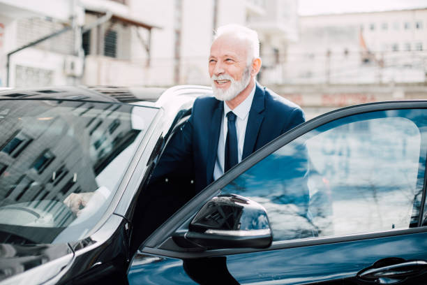 istock Mature business man entering a car 957769692