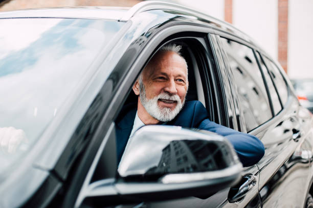 istock Happy senior business man in a car 957769786