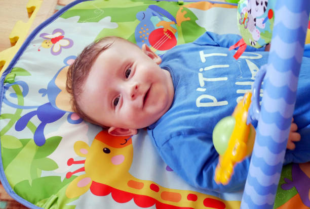 istock Happy baby playing with hanging toys. 957774838