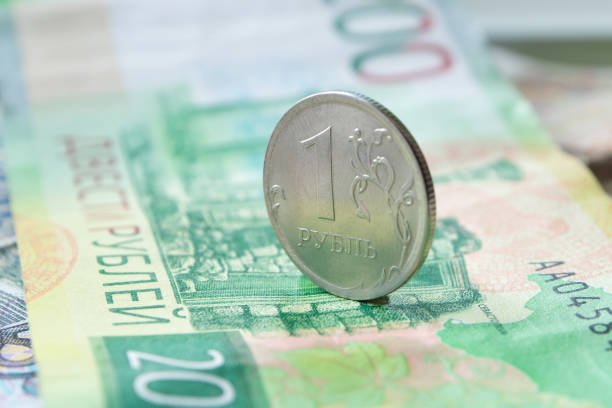 istock Russian coin one ruble on a banknote. 957777220