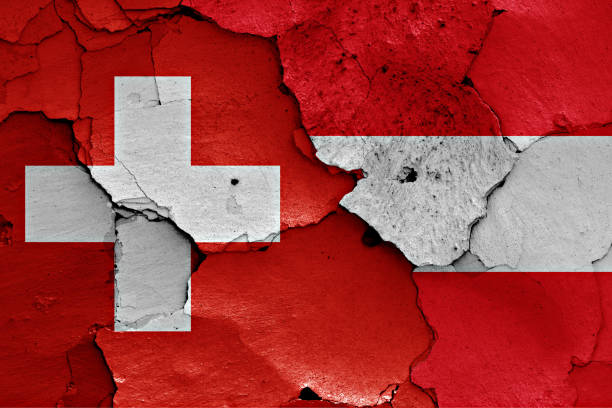 istock flags of Switzerland and Austria painted on cracked wall 957778744