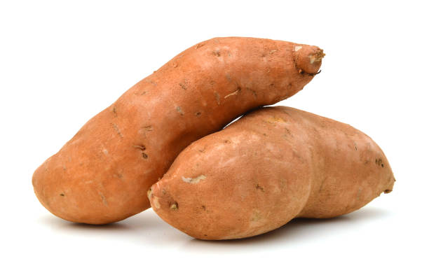 istock Raw, whole Sweet potatoes isolated on white background 957783554
