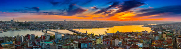 istock Long exposure panoramic cityscape of Istanbul at a beautiful dramatic clouds sunset from Galata to Golden Horn gulf. View of the wonderful romantic old town at Sea of Marmara. Istanbul. Turkey. 957790934
