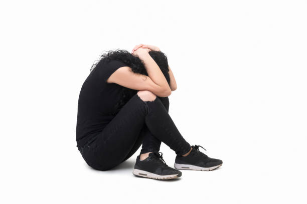 istock Woman exposed to violence protecting herself on a white background 957791402