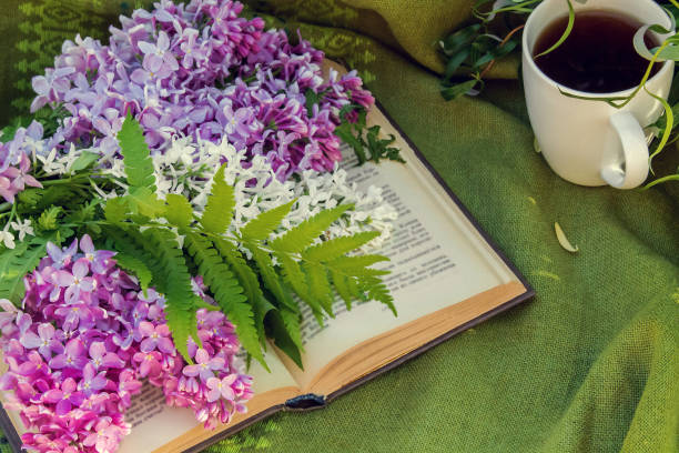 istock lilac, books and a Cup of tea 957791582