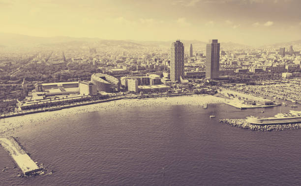 Many yachts lying at Port Olimpic in Barcelona, Spain. \nThis port - one of the three ports of Barcelona