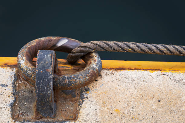 rusty mooring ring rusty ring for the mooring of a fishing vessel in port bollard pier water lake stock pictures, royalty-free photos & images