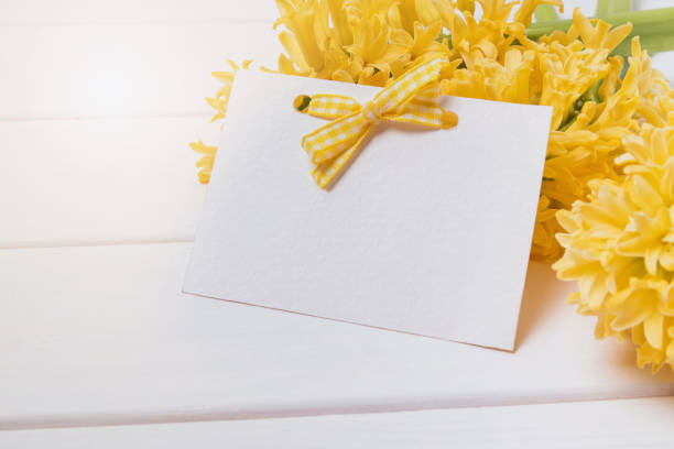 istock Blank greeting card template on the yellow hyacinth flowers 957797464