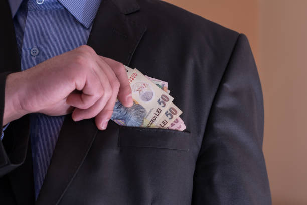 istock A man in a suit pulls out of his pocket Romanian banknotes 957801986