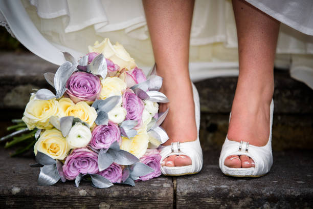 istock Closeup of bride feet / shoes 957804876