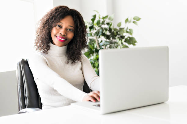 istock Beautiful black woman working on self employee office 957805062