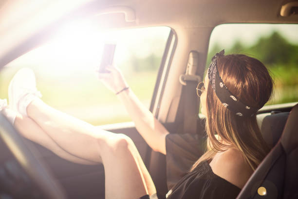 istock Boho girl in vintage van taking road trip selfie 957805394