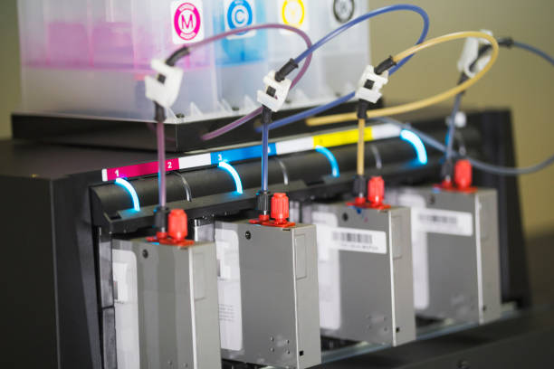 istock Color ink cartridges inside professional printing machine 957806026