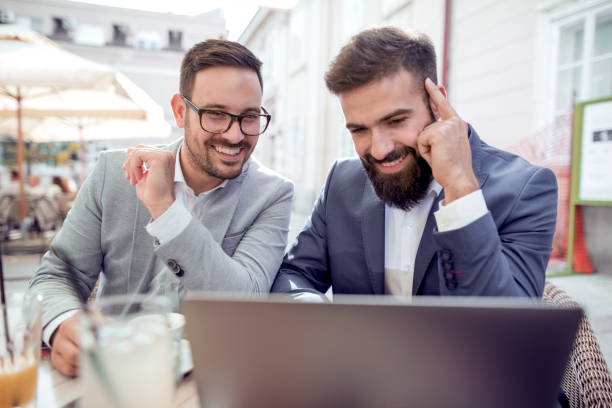 istock Two businessmen are working in cafe 957814658