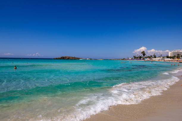 Ayia Napa, Cyprus - May 05, 2016: Nissi beach with crystal clean on foreground. People on background.