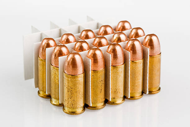 bullets many different size bullets isolated on white firing squad stock pictures, royalty-free photos & images