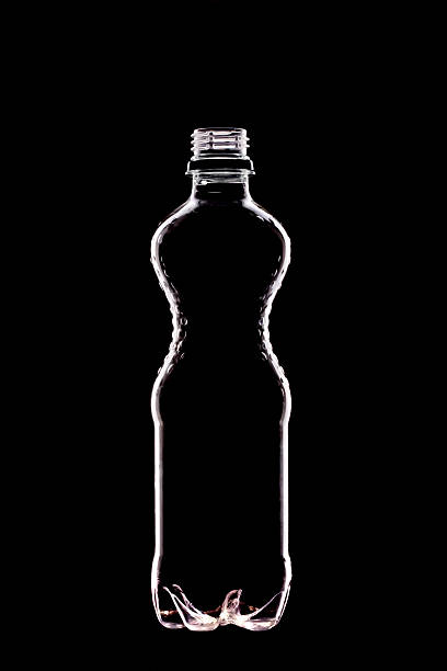backlit  water bottle stock photo
