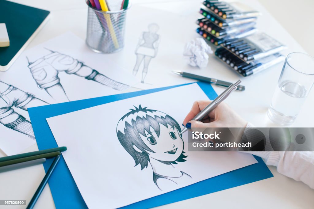 Freelancer working at her home office Freelancer working at her home office. Manga style painter. Manga Style Stock Photo
