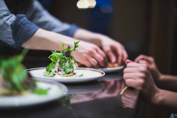 istock Cook preparing many plates in a restaurant kitchen. Catering 957820906