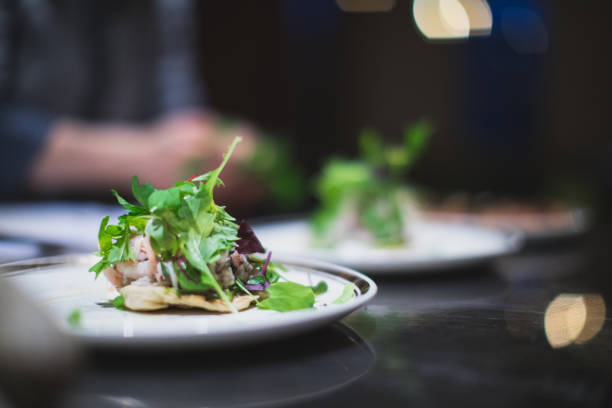istock Cook preparing northern prawns and salad. Restaurant and caterer in Canada 957820914