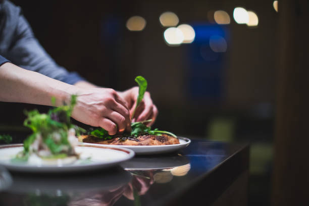 istock Cook preparing many plates in a restaurant kitchen. Catering. Food industry 957820940