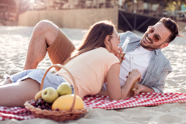 istock Couple on the beach 957828378