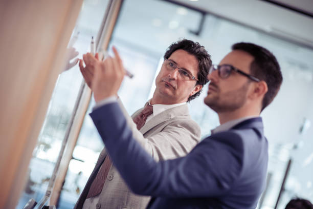 istock Business team members preparing a project together 957835818
