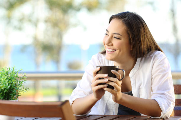 istock Woman looking at side in an apartment balcony 957836478