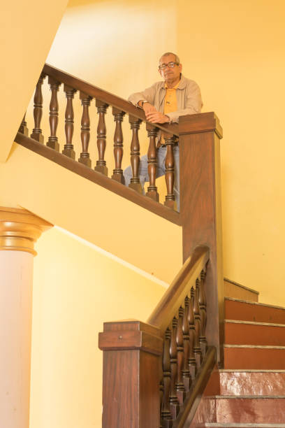 istock Man Poses at Colonial Architecture Stairs 957836574