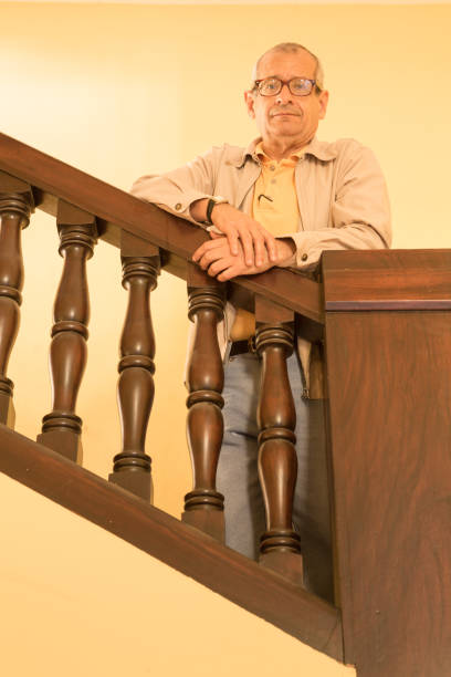 istock Man Poses at Colonial Architecture stairs 957837506