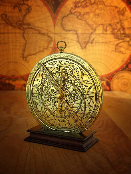 Still life of astrolabe instrument in front of antique world map.  The astrolabe was invented in 170 B.C. and used for navigational computations and astronomical calculations.  Modern surveying and navigational instruments are based on the astrolabe.  Click the thumbnail to see a lightbox of other instruments of measurement: