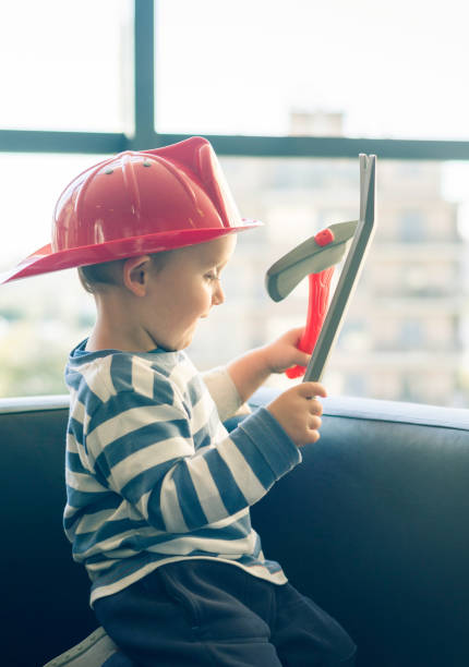 istock Cheerful hospitalized child disguised as a firefighter. 957838606