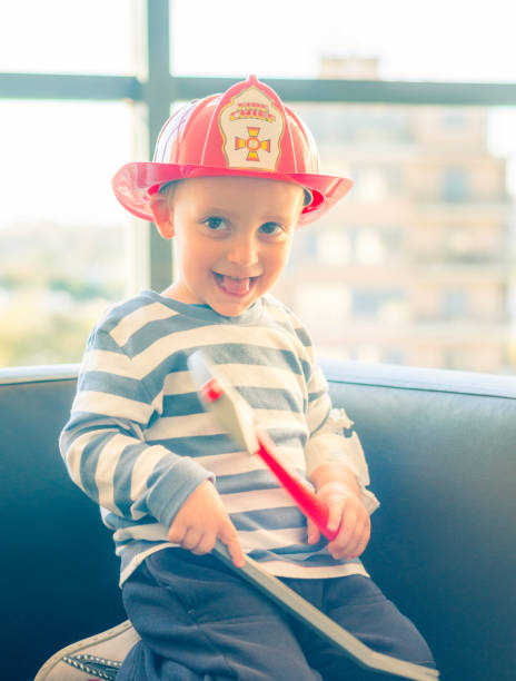 istock Cheerful hospitalized child disguised as a firefighter. 957841016