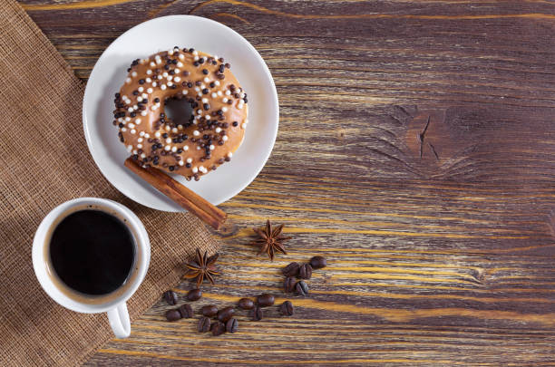 istock Coffee and donut with chocolate balls 957841724