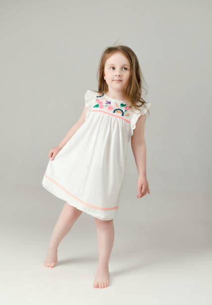 istock child in the Studio posing in fashionable clothes 957845694