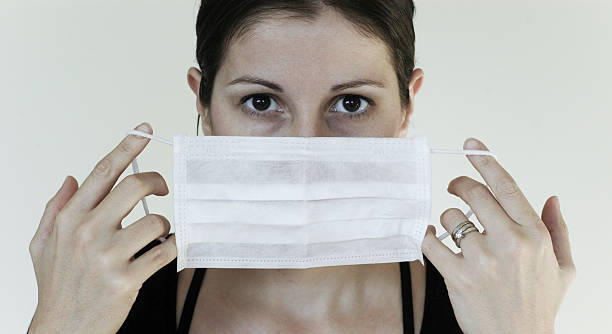 grippeschutzmaske - swine flu fotos stock-fotos und bilder