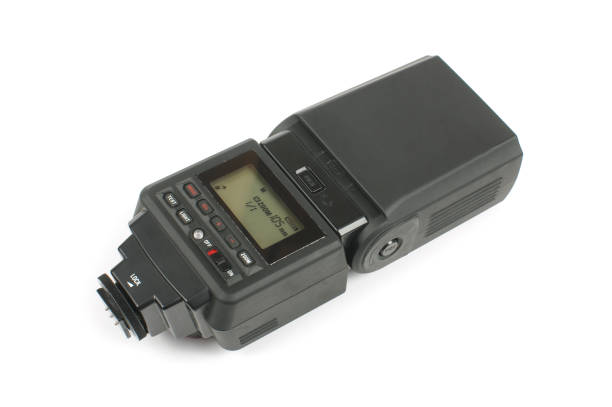 istock Speedlight for DSLR cameras isolated on the white background 957846830