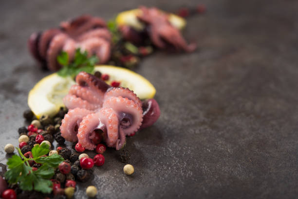 istock Pickled octopus with lemon and parsley 957849040
